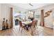 Dining area with sliding glass door to the outside, letting in ample natural light and view to the backyard at 1703 Daystar Dr, Haines City, FL 33844