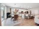 Dining room with modern chandelier, white wainscoting and big windows, creating a bright and inviting space at 1703 Daystar Dr, Haines City, FL 33844