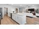 Open kitchen featuring stone countertops, a stainless steel dishwasher, and an island sink at 1703 Daystar Dr, Haines City, FL 33844