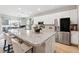 Modern kitchen with stainless steel appliances, granite countertops, and large island with seating at 1703 Daystar Dr, Haines City, FL 33844