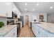 Spacious kitchen featuring granite countertops, stainless steel appliances, and ample cabinet space at 1703 Daystar Dr, Haines City, FL 33844