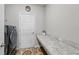 Laundry room with granite countertop space, washer/dryer hookups, and ample room at 1703 Daystar Dr, Haines City, FL 33844