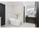 Modern bathroom featuring a soaking tub, vanity with dark cabinets and modern fixtures at 1840 Bryan Ave, Winter Park, FL 32789