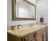 Bathroom vanity featuring framed mirror and a dark wood cabinet at 1840 Bryan Ave, Winter Park, FL 32789