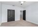 Neutral bedroom featuring carpeted floors and dark double doors at 1840 Bryan Ave, Winter Park, FL 32789