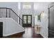 Grand foyer showcases elegant staircase, soaring ceilings, and stylish decor, creating a welcoming ambiance at 1840 Bryan Ave, Winter Park, FL 32789