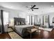 Spacious main bedroom featuring hardwood floors, ceiling fan and a sitting area at 1840 Bryan Ave, Winter Park, FL 32789