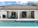 Inviting outdoor patio with seating and views of the pool, ideal for al fresco dining at 1840 Bryan Ave, Winter Park, FL 32789