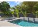 Backyard pool featuring a spa, fountains, and lush landscaping at 1840 Bryan Ave, Winter Park, FL 32789
