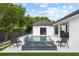 Inviting pool area with spa, waterfall features, and beautiful landscaping at 1840 Bryan Ave, Winter Park, FL 32789
