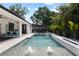 Refreshing pool with fountains and lounge area, perfect for outdoor entertaining and relaxation at 1840 Bryan Ave, Winter Park, FL 32789