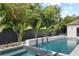 Backyard pool featuring a spa, fountains, and lush landscaping at 1840 Bryan Ave, Winter Park, FL 32789