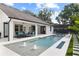 Backyard pool featuring a spa, fountains, and covered patio at 1840 Bryan Ave, Winter Park, FL 32789