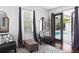 Sitting area with decor and patio access near the backyard pool area at 1840 Bryan Ave, Winter Park, FL 32789