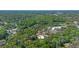 Aerial view of the property with lush greenery surrounded by trees at 20 Lido Rd, Winter Springs, FL 32708