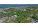 Areal shot showing the privacy of the home with the proximity to the lake and other community features at 20 Lido Rd, Winter Springs, FL 32708