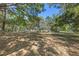 A large backyard with lots of shaded space due to the mature trees throughout the property at 20 Lido Rd, Winter Springs, FL 32708