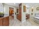 Well appointed bathroom features dual vanities, wood cabinetry, and decorative mirrors and fixtures at 20 Lido Rd, Winter Springs, FL 32708