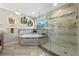 Luxurious bathroom showcasing a large soaking tub and an enclosed glass shower at 20 Lido Rd, Winter Springs, FL 32708