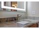 Bathroom vanity features a stainless faucet, white sink, and granite countertop at 20 Lido Rd, Winter Springs, FL 32708
