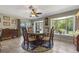 Charming dining area with a glass table, bay window, and direct access to outdoor patio at 20 Lido Rd, Winter Springs, FL 32708