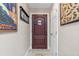 Welcoming entryway with a sturdy, dark wood door and neutral wall colors at 20 Lido Rd, Winter Springs, FL 32708