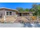 View of covered front porch and front door area of home with stone accents at 20 Lido Rd, Winter Springs, FL 32708
