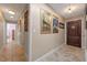 Hallway with stylish decorations including pictures, shelving, and vintage decor at 20 Lido Rd, Winter Springs, FL 32708