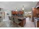 Spacious kitchen featuring a large island with dark granite countertops and ample counter seating at 20 Lido Rd, Winter Springs, FL 32708