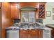 Modern kitchen counter with dark countertops, stainless steel appliances, and ample cabinet space at 20 Lido Rd, Winter Springs, FL 32708