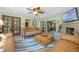 Open concept living room featuring a fireplace and views of the kitchen and other parts of the house at 20 Lido Rd, Winter Springs, FL 32708