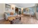 Comfortable living room featuring hardwood floors, neutral colors, and multiple windows for natural light at 20 Lido Rd, Winter Springs, FL 32708