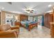 Expansive primary bedroom featuring tile floors, a seating area, and outdoor access at 20 Lido Rd, Winter Springs, FL 32708