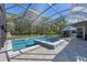 Beautifully designed pool area with spa, surrounded by a screened enclosure and lush landscaping, providing a serene retreat at 20 Lido Rd, Winter Springs, FL 32708