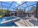 Backyard pool with spa, and lounge chairs; an ideal setting for relaxation and entertainment in a private screened enclosure at 20 Lido Rd, Winter Springs, FL 32708