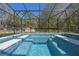 This tiled pool and jacuzzi are fully screened-in with a beautiful blue at 20 Lido Rd, Winter Springs, FL 32708