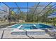 Enclosed pool area with a spa, a tiled deck and a spacious screen enclosure that offers privacy and protection at 20 Lido Rd, Winter Springs, FL 32708