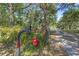 Gated entrance and fire hydrant along the driveway at 20 Lido Rd, Winter Springs, FL 32708