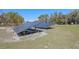 Two large solar panel arrays in an open yard on a sunny day at 20 Lido Rd, Winter Springs, FL 32708