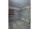 Unfinished basement with exposed concrete walls and boarded window at 2115 Messina Ave, Orlando, FL 32811