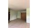 Empty living room with boarded window and tiled floors at 2115 Messina Ave, Orlando, FL 32811