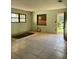 Living room with boarded window and tiled floors at 2115 Messina Ave, Orlando, FL 32811