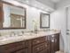 Bathroom features a dual sink vanity with granite counters and framed mirrors above at 226 Ringwood Dr, Winter Springs, FL 32708