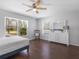 Bright bedroom features hardwood floors, a ceiling fan, and lots of natural light at 226 Ringwood Dr, Winter Springs, FL 32708