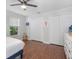 Spacious bedroom featuring hardwood floors, a ceiling fan, and bright natural light at 226 Ringwood Dr, Winter Springs, FL 32708