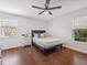 Comfortable bedroom featuring a ceiling fan, hardwood floors and lots of natural light at 226 Ringwood Dr, Winter Springs, FL 32708