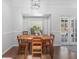 Cozy dining room with natural light, hardwood floors, and easy access to the backyard at 226 Ringwood Dr, Winter Springs, FL 32708