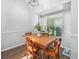 Well-lit dining room with hardwood floors, wainscoting, and a serene view at 226 Ringwood Dr, Winter Springs, FL 32708
