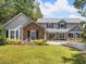 Charming two-story home featuring a manicured lawn, brick accents, and a welcoming front entrance at 226 Ringwood Dr, Winter Springs, FL 32708