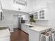 Modern kitchen featuring white cabinetry, stainless steel appliances, and a breakfast bar at 226 Ringwood Dr, Winter Springs, FL 32708